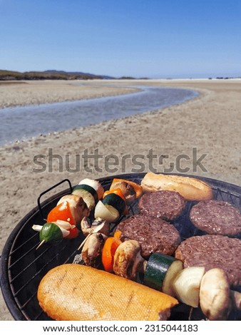 Making barbecue at sandy beach by the river at Silverstrand in County Mayo, Ireland 