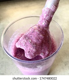 Making Blueberry Protein Milkshake In A Glass With A Hand Blender. A Healthy And Tasty Snack For Children And Adults. Hand Blender. Purple Fresh Berry Smoothie. 