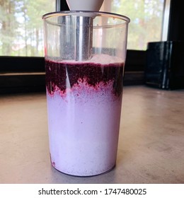 Making Blueberry Protein Milkshake In A Glass With A Hand Blender. A Healthy And Tasty Snack For Children And Adults. Hand Blender. Purple Fresh Berry Smoothie. 