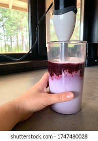 Making Blueberry Protein Milkshake In A Glass With A Hand Blender. A Healthy And Tasty Snack For Children And Adults. Hand Blender. Purple Fresh Berry Smoothie. 