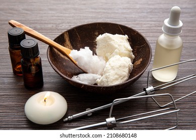 Making Bodywhip Also Known As Body Butter, Skin Care Moisturizer Cream. Ingredients On Wood Background: Shea Butter,solid Coconut Oil, Sweet Almond Oil And Essential Oils.