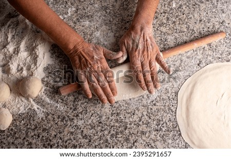 Making bread with a rolling pin, yeast dough, Turkish style