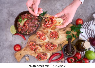 Making Bruschetta With Freshly Made Salsa Dip Sauce