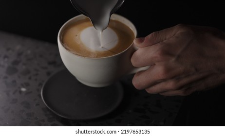 Making Cappuccino, Pour Steamed Milk Into White Cup With Espresso