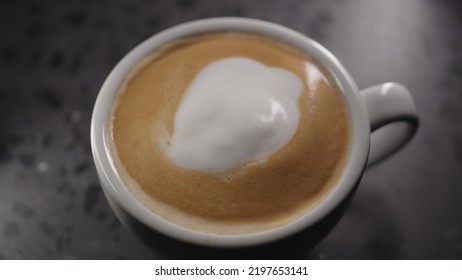 Making Cappuccino, Pour Steamed Milk Into White Cup With Espresso