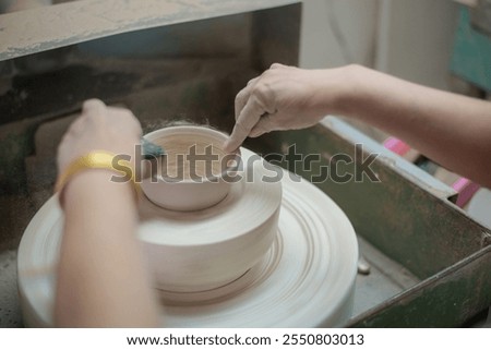 Making ceramic glasses.Making a round cup and polishing it into a round shape.