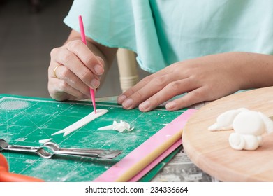 The making of christmas fondant cake in kitchen. - Shutterstock ID 234336664