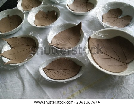 Making clay trays in the shape of leaves