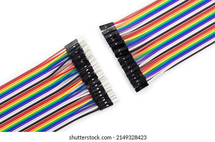 Making connections. Colorful Computer flat cable with micro pin connectors.  Ribbon cable with male and female connectors isolated on white.