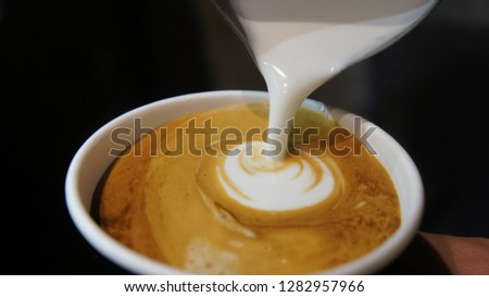 making cup of latte