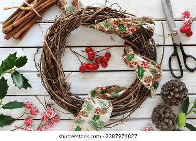 Making a DIY Christmas grapevine wreath with craft supplies - Powered by Shutterstock