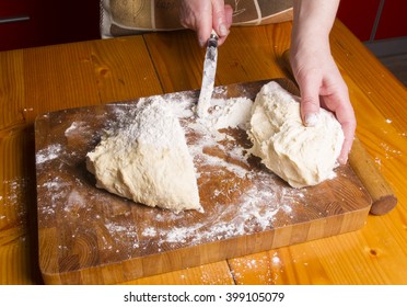 Making dough by female hands on wooden table background - Shutterstock ID 399105079
