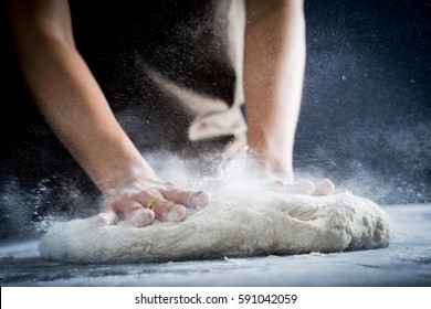 Making dough by female hands at bakery - Powered by Shutterstock