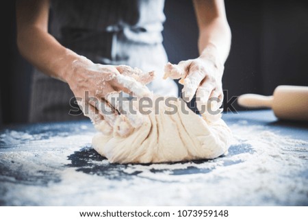 Similar – woman kneading bread dough with her hands