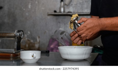 Making falafel balls in the kitchen.  - Shutterstock ID 2257974395