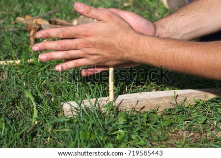 Making fire with hands	