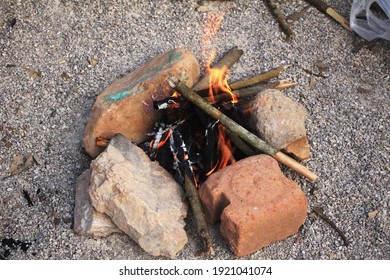 Making a fire using ancient wood for cooking and to keep warm.