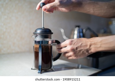 Making French Press coffee in the kitchen - Powered by Shutterstock