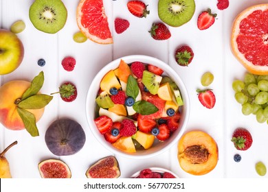 Making Fruit Salad. Delicious Fruits And Berries An The Table, Top View.