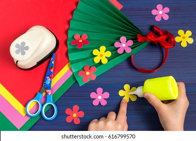 Making Gift For Mother's Day By The Child. Colorful Bouquet Of Flowers Out Of Paper. Children's Art Project. DIY Concept. Step-by-step Photo Instruction. Step 6. Child Glues Flowers On A Fan