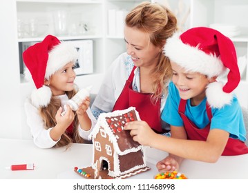 Making a gingerbread cookie house with the kids at christmas time - Powered by Shutterstock