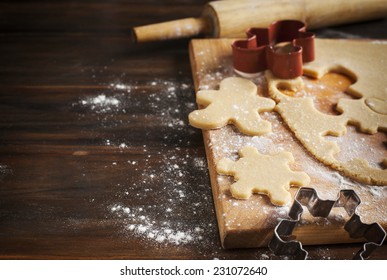 Making Gingerbread Cookies. Christmas Baking Background Dough And Cookie Cutters