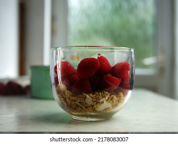 Making Granola And Raspberries For A Healthy Breakfast Close Up Shot Selective Focus