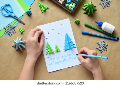 Making Greeting Card With Origami 3D Xmas Tree From Paper. Merry Christmas And Happy New Year Decoration. Children's DIY Concept. Handmade Crafts On Holiday With Your Own Hands.