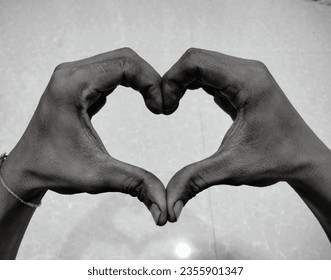 Making a hand in the shape of a poor person s heart indicates love and sincerity from a black person