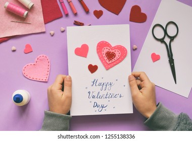 Making of handmade Valentine greeting card from felt. Children's DIY, hobby concept, gift with your own hands. Valentine's Day decoration.