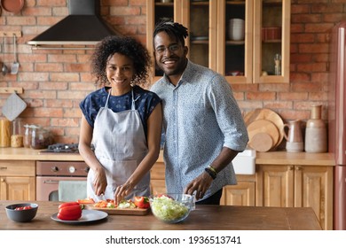 Making Healthy Food Choice. Family Portrait Of Loving Young Afro American Spouses Cook Easy Breakfast Of Fresh Vegetables Together. Millennial Black Couple In Love Look At Camera Enjoy Cooking At Home