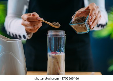 Making Healthy Shake With Berries And Plant Protein Powder