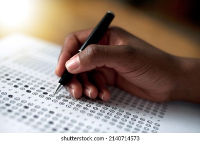 Making His Choices. Cropped Shot Of A Person Filling Out A Multiple Choice Questionnaire.