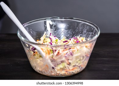 Making Homemade Coleslaw In A Glass Bowl.