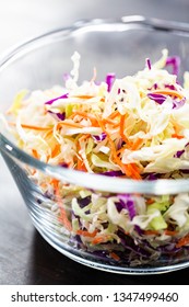 Making Homemade Coleslaw In A Glass Bowl.