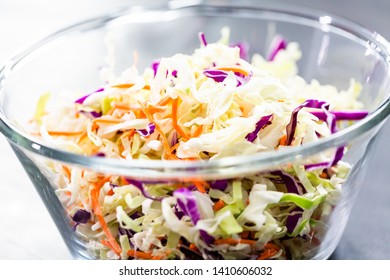 Making Homemade Coleslaw In A Glass Bowl.