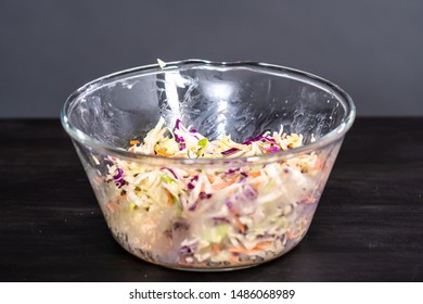 Making Homemade Coleslaw In A Glass Bowl.