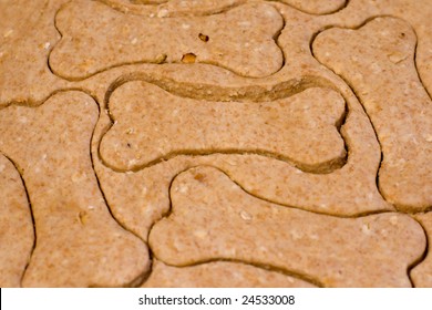 Making Homemade Dog Treats In The Shape Of A Bone.