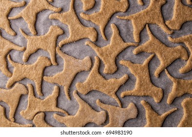 Making Homemade Dog Treats In The Shape Of A Bone.