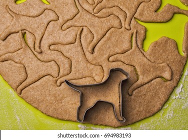 Making Homemade Dog Treats In The Shape Of A Bone.