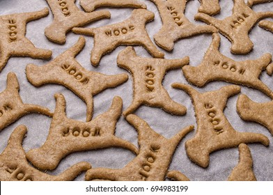 Making Homemade Dog Treats In The Shape Of A Bone.