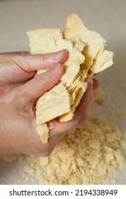 Making Homemade Napoleon Cake. One Layer Is Broken Into Small Pieces For Sprinkling The Cake