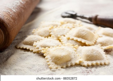 Making homemade ravioli with a wooden roller - Powered by Shutterstock