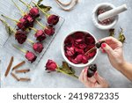 Making homemade rose potpourri by drying roses petals and adding essential oils spices, DIY