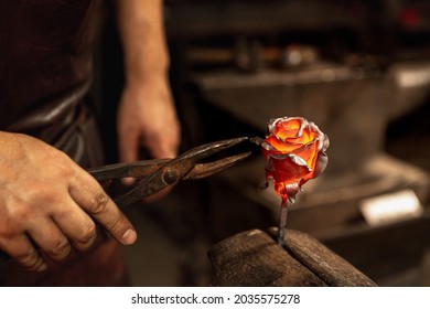 Making iron, metal flower. Bearded man, blacksmith manually forging the molten metal on the anvil in smithy with spark fireworks. Concept of labor, retro vintage occupation, family business - Powered by Shutterstock