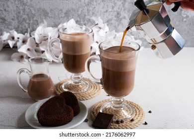 Making A Latte From Chocolate Oat Milk And Natural Coffee For Breakfast. Coffee Is Prepared In A Geyser Coffee Maker.