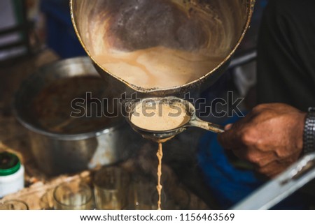 Making Masala milk tea for sale in the street of kathmandu Nepal.Street Food for sale.
