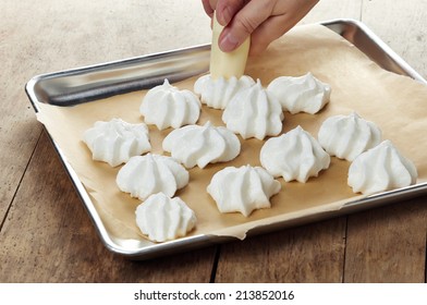 Making Meringue Cookies On A Cooking Pan