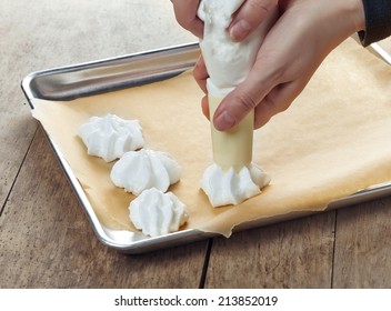 Making Meringue Cookies On A Cooking Pan