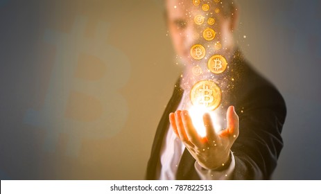 making money with bitcoin - Business man creating bitcoins with his hand